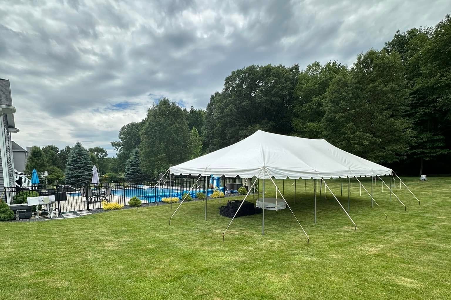 White event tents set up on a lawn