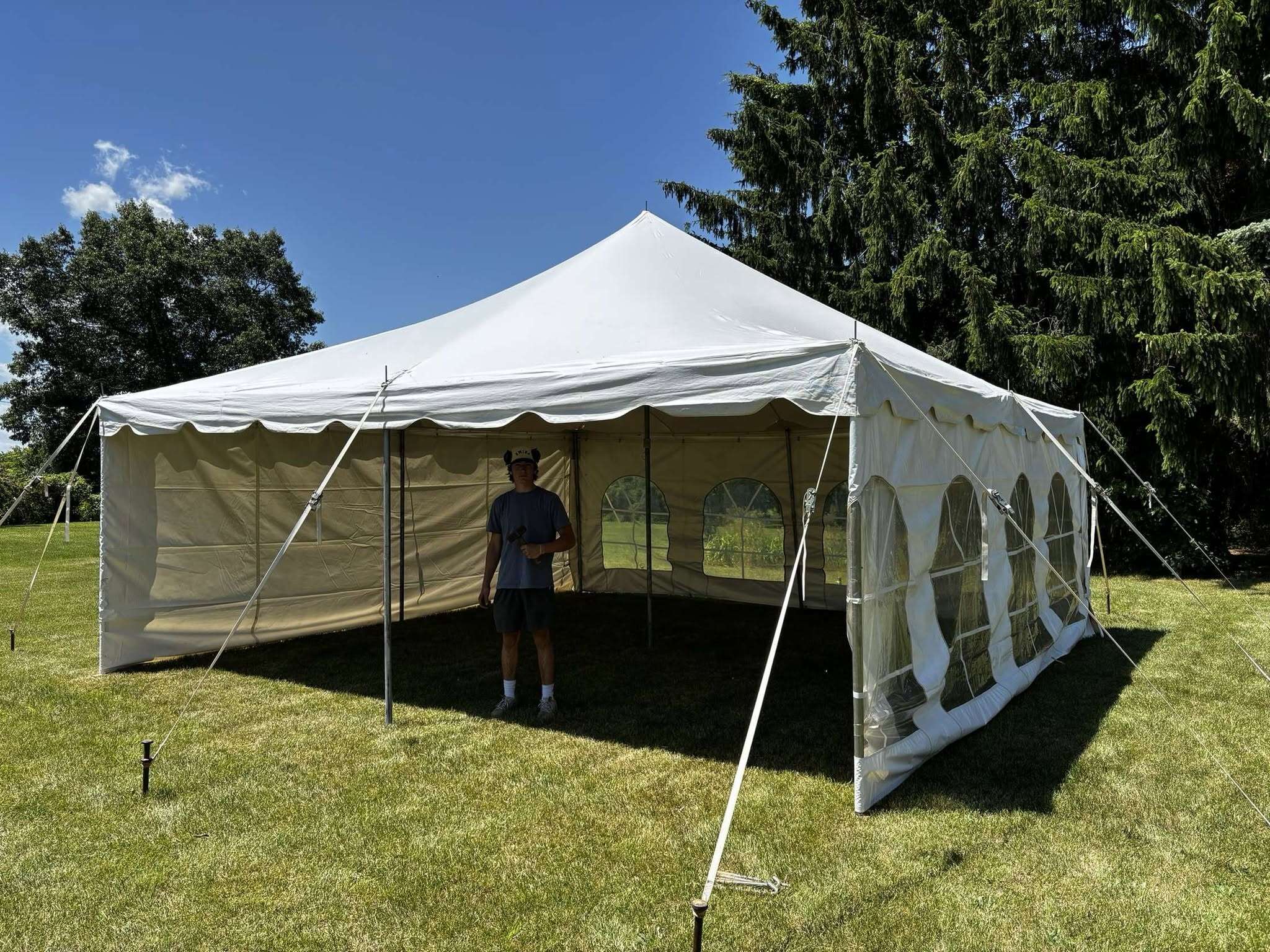 20x20 Pole Tent set up on a lawn in Jackson, MI