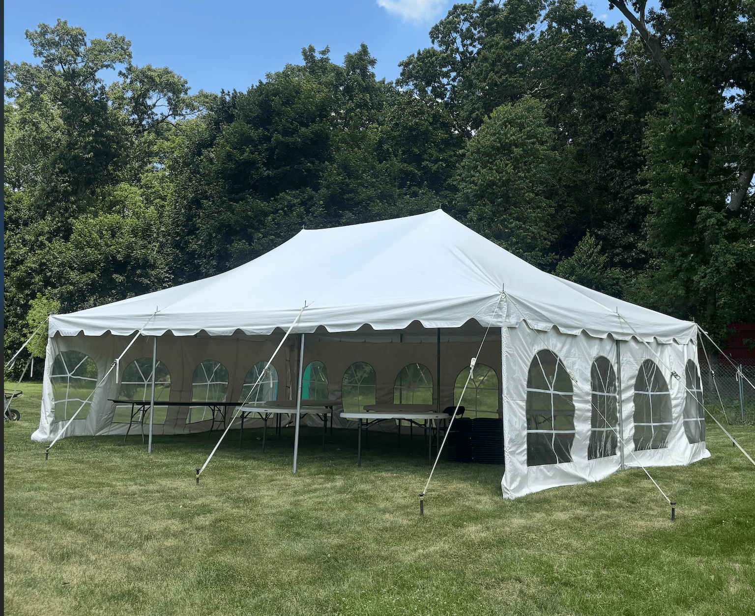 20x30 Pole Tent set up on a lawn in Jackson, MI